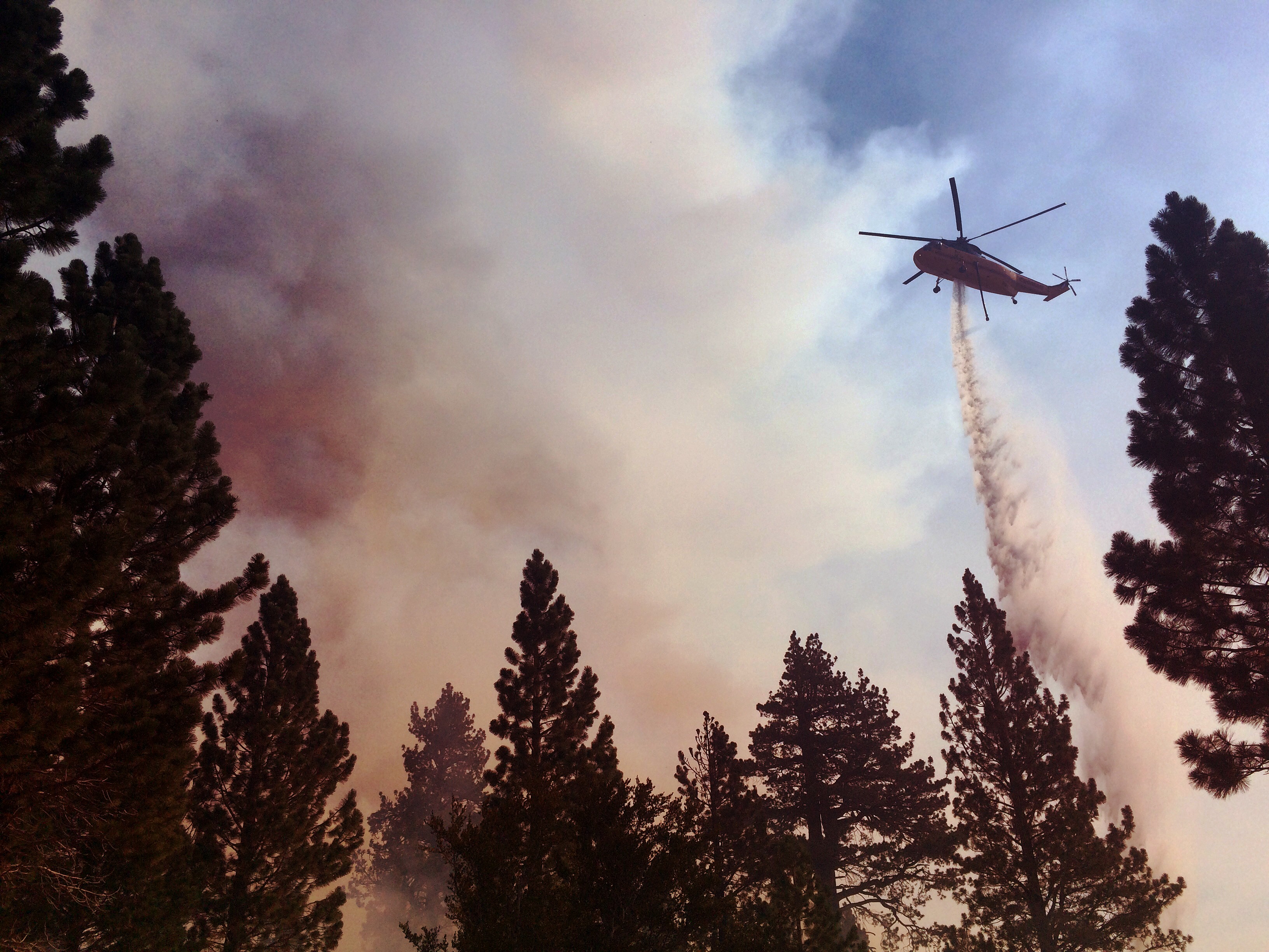 Helicopter fighting wildland fire from the air. Photo taken by ExpertVoice Expert Gregg Boydston.