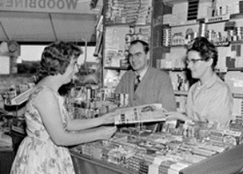 Retail sales associates from 1950's helping customer