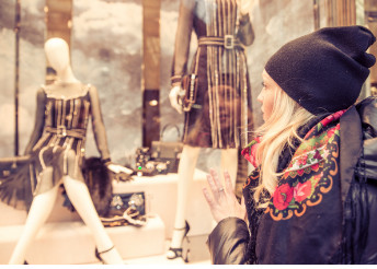 Female consumer window shopping